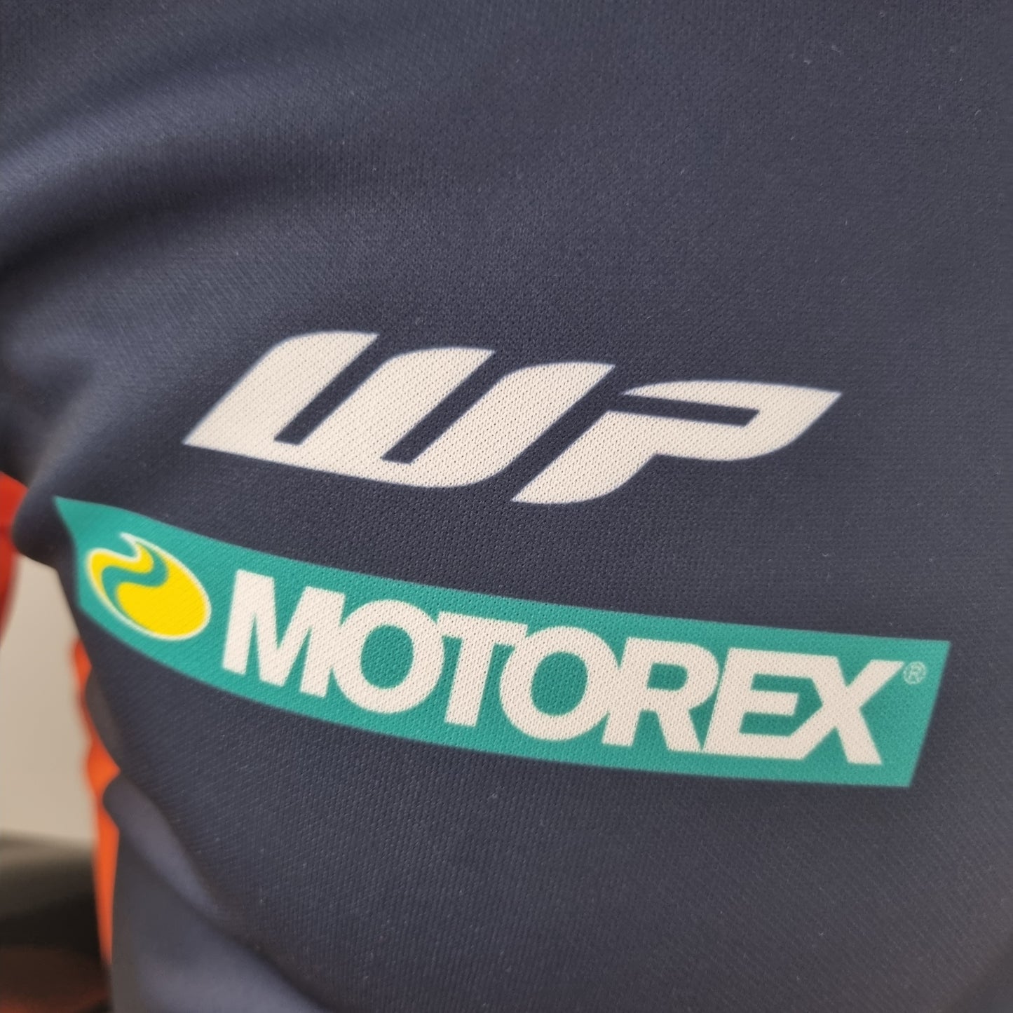 Red Bull KTM Racing Team 2023 Polo – Player Fit | Navy Orange