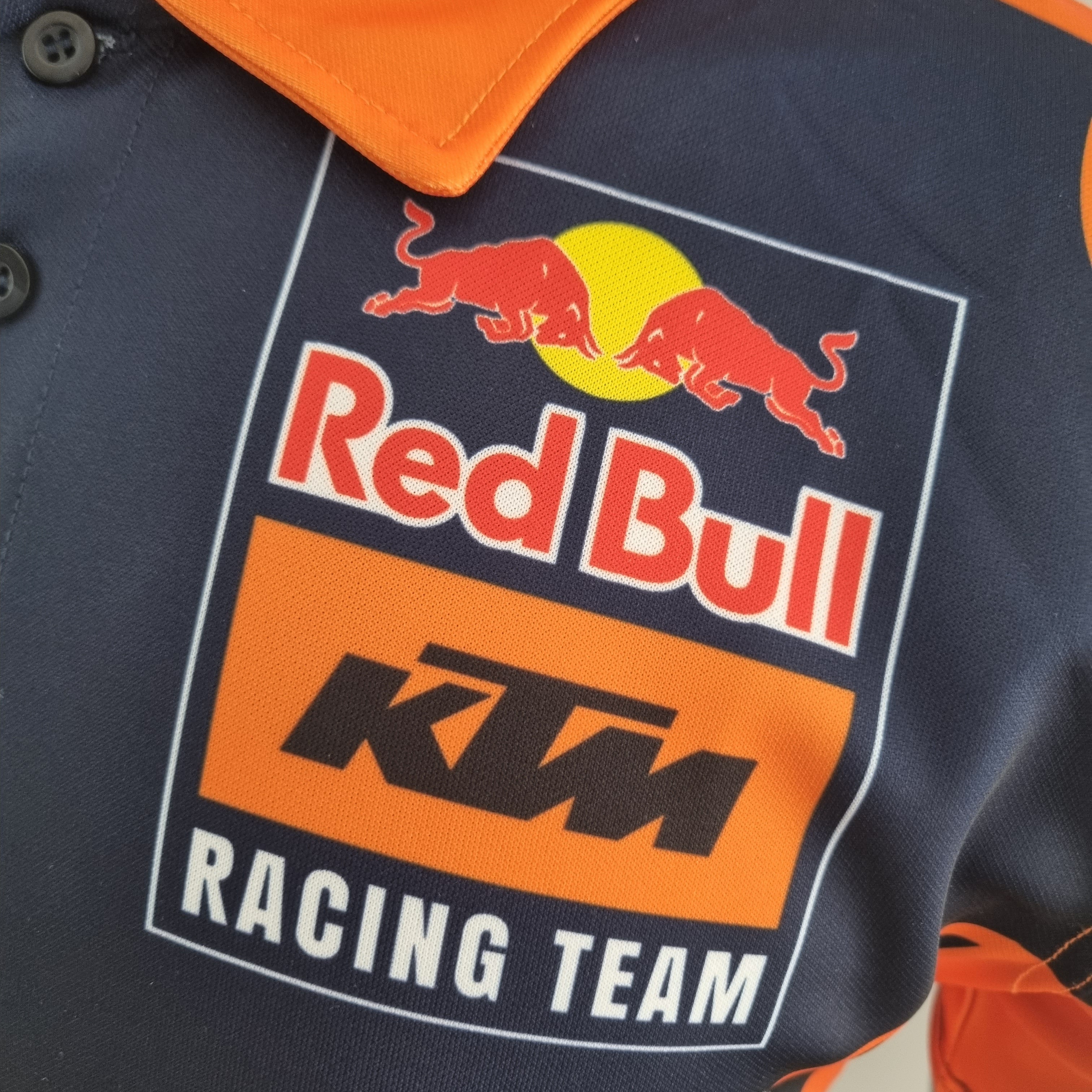 Red Bull KTM Racing Team 2023 Polo – Player Fit | Navy Orange